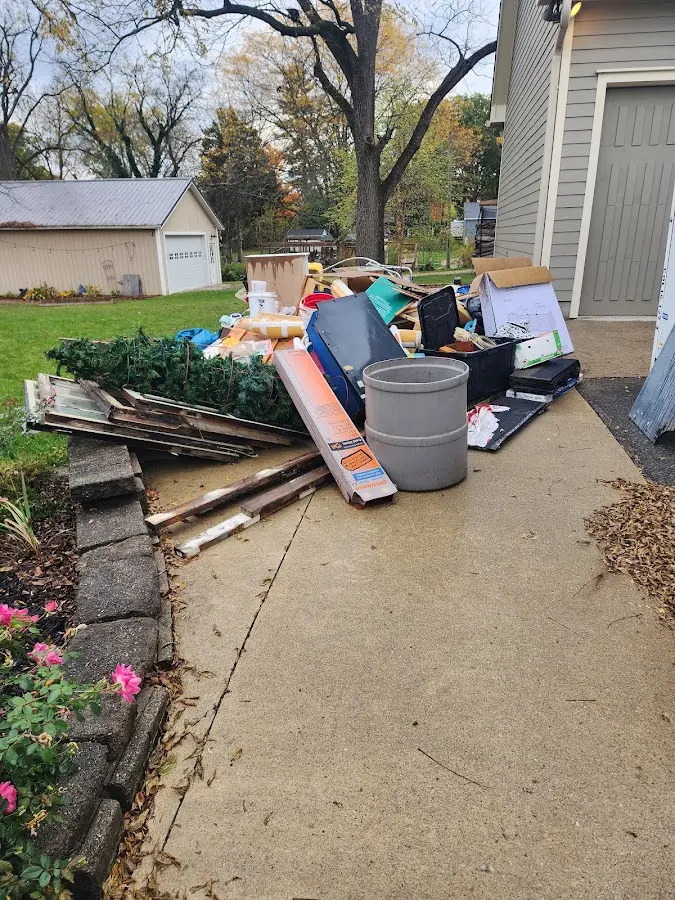 Dumpster being loaded with debris for 30 Yard Dumpster Rental in Irmo